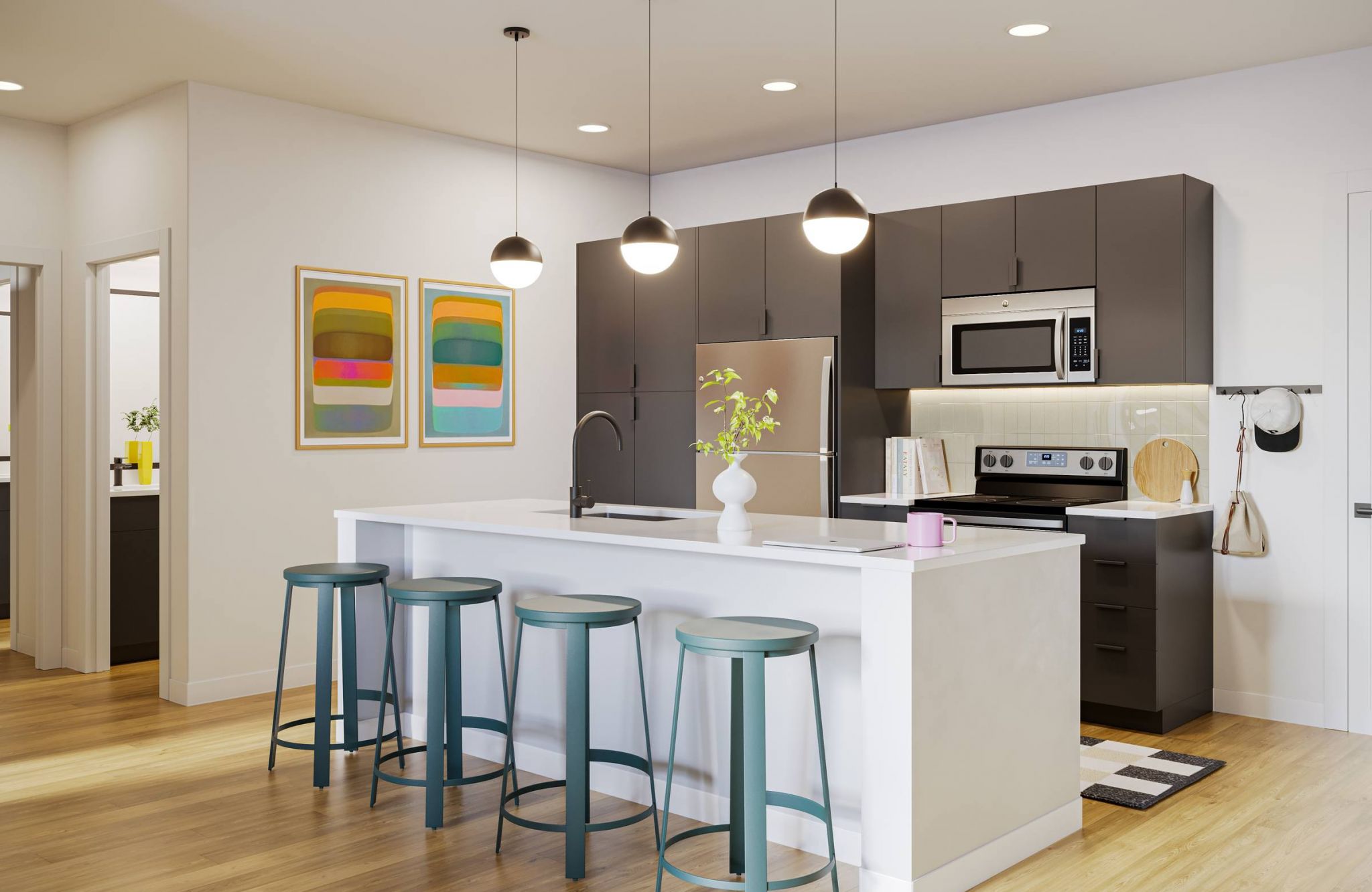 EVER West Lafayette apartment kitchen with island, pendant lighting, and stainless steel appliances